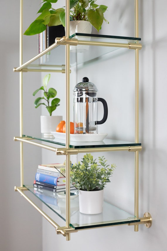 Brass and sale glass shelving unit