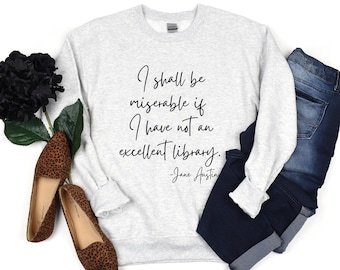 May include: A gray sweatshirt with the quote "I shall be miserable if I have not an excellent library. -Jane Austen" printed on the front.