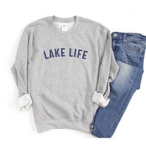 May include: Gray sweatshirt with the text "LAKE LIFE" in navy blue lettering.