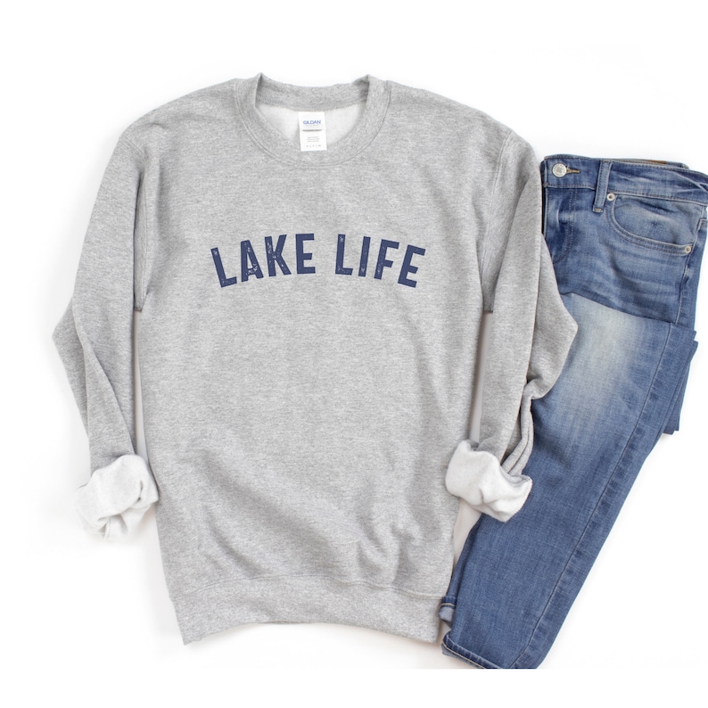 May include: Gray sweatshirt with the text "LAKE LIFE" in navy blue lettering.