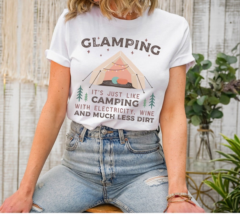 May include: White t-shirt with a graphic of a tent and the text "GLAMPING It's just like CAMPING with electricity, wine and much less dirt."