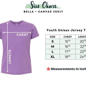 May include: A lilac youth unisex jersey tee with a size chart. The chart shows chest and length measurements in inches for sizes S, M, L, and XL. The text "Measurements in Inches" is below the chart.