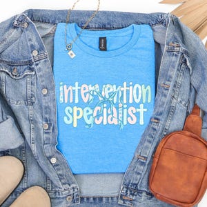 Intervention Specialist Softstyle T-Shirt, Coquette Style Intervention Teacher Shirt