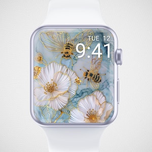 May include: A white Apple Watch with a floral watch face. The watch face features a blue and white marble background with gold accents and bees. The time is 9:41 and the day is Tuesday the 12th.