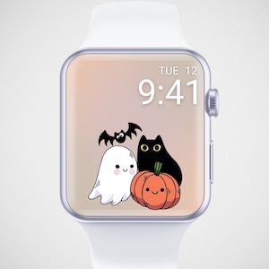 May include: A white smartwatch with a Halloween-themed display. The screen shows a cartoon ghost, black cat, pumpkin, and bat. The time is 9:41 AM, and the day is Tuesday.