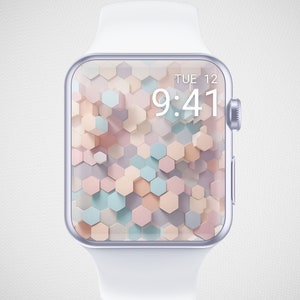 May include: A white smartwatch with a silver bezel and a colorful geometric pattern on the screen. The time is 9:41 and the date is TUE 12.