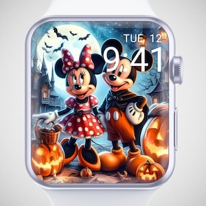 May include: A white Apple Watch with a Halloween-themed watch face featuring Mickey and Minnie Mouse. Minnie wears a red polka-dot dress and bow, while Mickey is in a cape. Jack-o'-lanterns and a spooky castle are in the background. The time is 9:41.