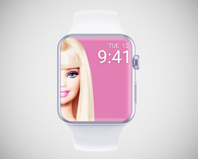 Puede incluir: Un smartwatch blanco con una esfera rosa y una imagen de una mujer rubia con ojos azules. La hora es 9:41 y el d&iacute;a es martes 12.