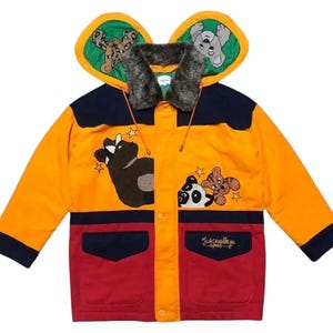 May include: A vibrant children's jacket with a hood and animal illustrations. The jacket is predominantly orange, with navy and red panels. It features cartoon bear, panda, and tiger graphics, and the hood has animal ear shapes.