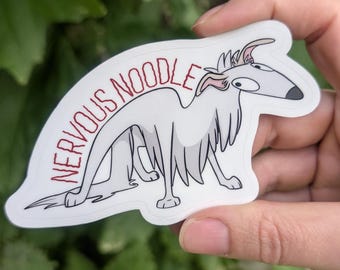 May include: A white die-cut sticker featuring a cartoon illustration of a long-haired dog with wide, startled eyes and a black nose. The text NERVOUS NOODLE is printed in red, jagged capital letters above the dog's back on the white background.