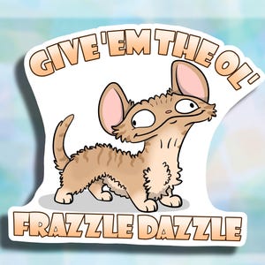 May include: A sticker featuring a cartoon cat with the text "Give 'em the ol' Frazzle Dazzle" in orange.