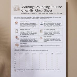 Printed Morning Grounding Routine Checklist cheat sheet displayed on a wall with natural light, highlighting the daily rituals and 7-day habit tracker.