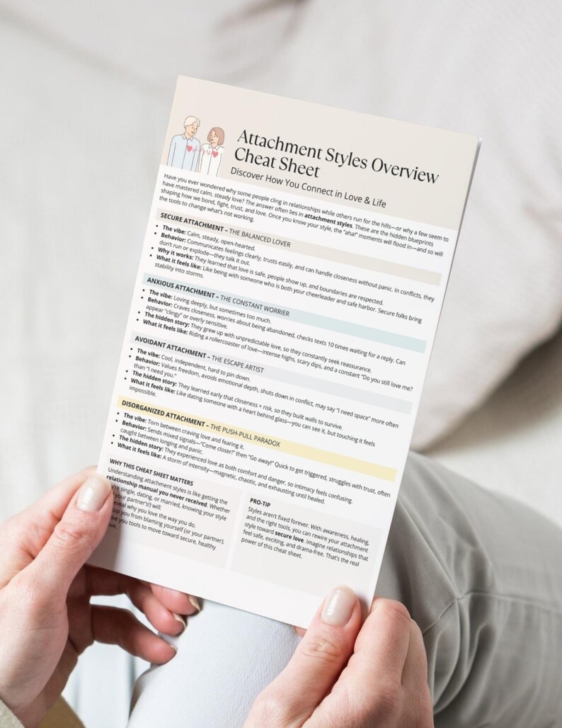 Casual lifestyle mockup of the Attachment Styles Overview Cheat Sheet being held by a person, highlighting the clean and easy-to-read layout.