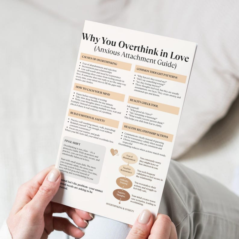 May include: A printed guide titled "Why You Overthink in Love (Anxious Attachment Guide)" held by a person. The guide features sections on causes of overthinking, calming the mind, and building emotional safety. The text is in black and brown.