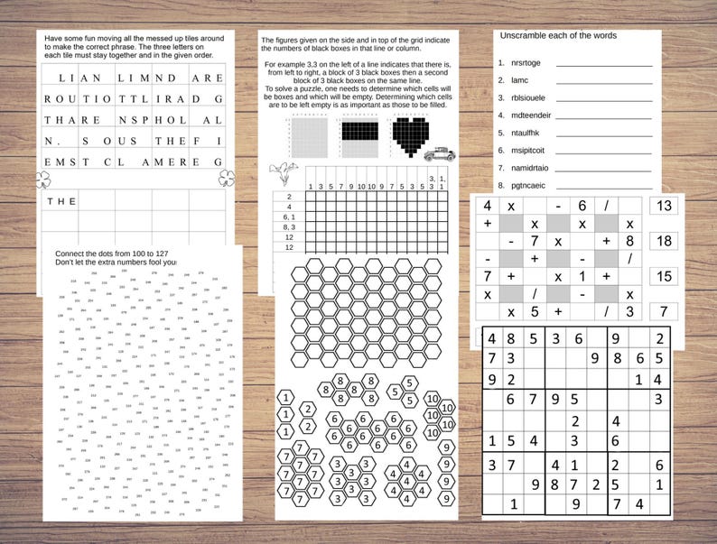 May include: A collection of printable puzzle sheets, including word scrambles, connect-the-dots, and Sudoku. The pages are white with black text and graphics, designed for educational and recreational activities. The sheets are arranged on a wooden surface.