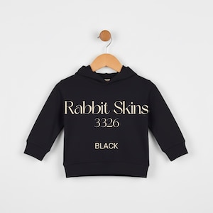 May include: Black hooded sweatshirt with the text "Rabbit Skins 3326 BLACK". The sweatshirt is hanging on a wooden hanger against a white background. The garment has long sleeves and a hood.