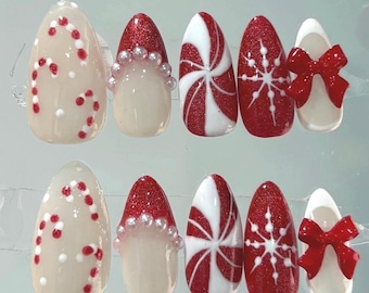 Met de hand geschilderd snoepgoed voor de feestdagen: druk op de nagels: rode en witte amandelkerstnagels