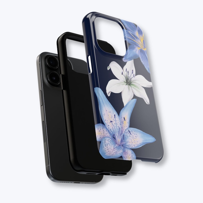 May include: A black smartphone with a protective case featuring a floral design. The case has a dark blue background with watercolor-style blue and white lilies. The phone and case are displayed against a light background.