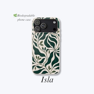 May include: A biodegradable phone case featuring a dark green, flowing leaf pattern on a speckled off-white background. The case has a black camera cutout area with three circular lenses. The text "Biodegradable phone case" and "Isla" appear.