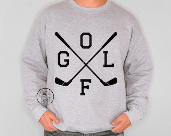 May include: Gray sweatshirt with a black graphic of two crossed golf clubs and the word "GOLF" with the letter "F" in a larger font.