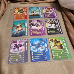 Mélangez divers lots de 9 cartes à collectionner Skylanders Giants. Vendu les 9 ensemble dans ce support en plastique transparent n° 2