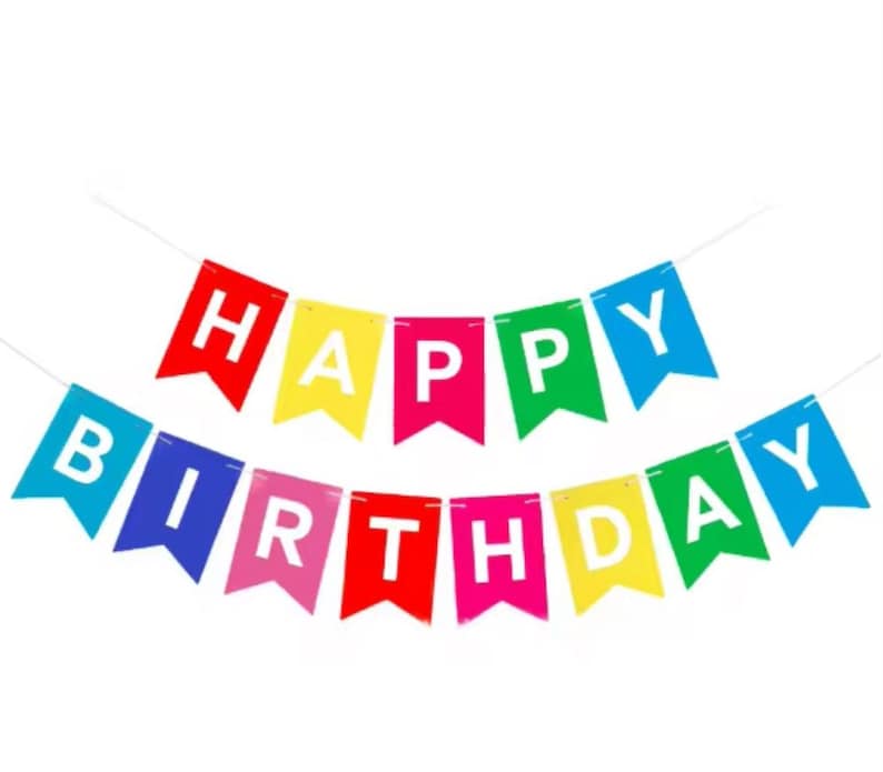May include: A colorful "Happy Birthday" banner. The banner features individual pennants in red, blue, yellow, green, and pink, each displaying a letter in white. The banner is strung on a thin white string.