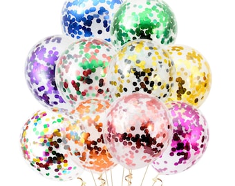 Puede incluir: Un montón de globos transparentes con confeti de colores en su interior. Los globos son de varios colores, entre ellos morado, verde, dorado, rojo y azul.
