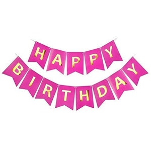 May include: A pink banner with gold lettering that reads "HAPPY BIRTHDAY". The banner is made of individual pennants strung together. The background is white.