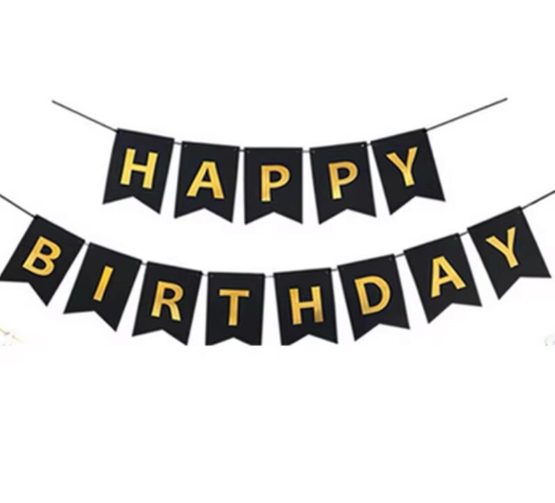 May include: Black banner with gold letters spelling "HAPPY BIRTHDAY". The banner is strung on a thin black string. The letters are in a bold, sans-serif font, creating a festive and celebratory feel.