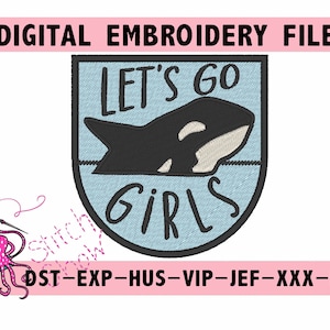 Può includere: Una toppa ricamata blu e bianca con una balena orca nera e bianca e il testo "LET'S GO GIRLS".