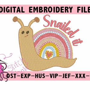 May include: A digital embroidery design featuring a brown snail with a rainbow shell and the text "Snailed it". The design is perfect for creating personalized projects like t-shirts, tote bags, and home decor.