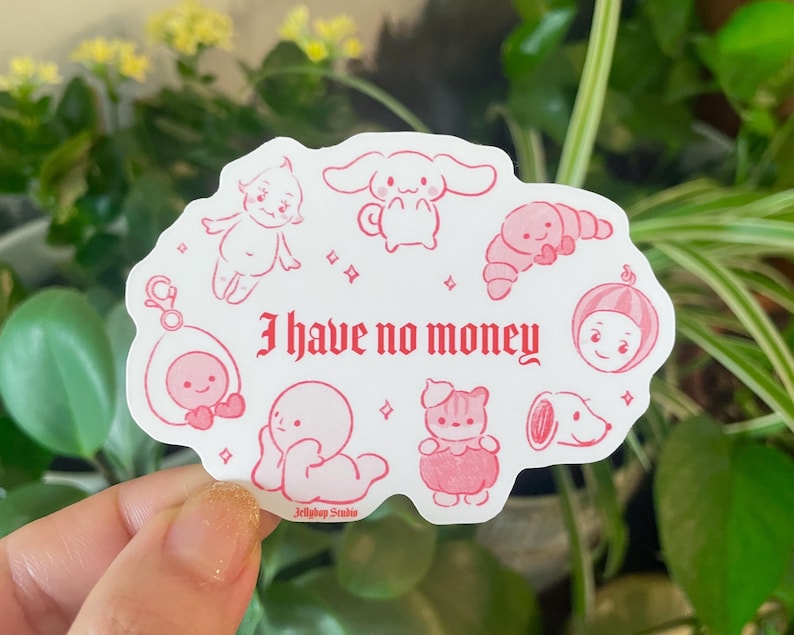 以下が含まれることがあります： ピンクと白のステッカーに、さまざまなキャラクターの漫画のイラストと「I have no money」というテキストが描かれています。