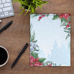 May include: A blue and white watercolour background with a snowy forest scene. The border is decorated with red poinsettia flowers, green leaves, and white cotton balls.