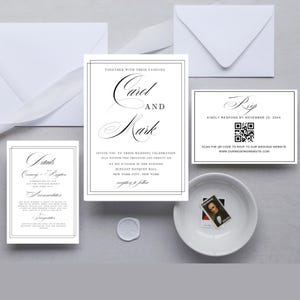 May include: A wedding invitation suite with a black and white design. The main invitation features the names "Carol and Mark" in elegant script. The RSVP card includes a QR code and the text "Kindly respond by November 25, 20xx".