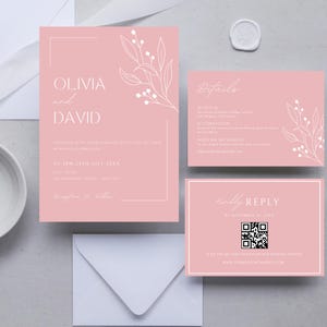 May include: Pink wedding invitation suite featuring a white floral design. The invitation includes the names Olivia and David, the date and time of the wedding, and the location. The RSVP card includes a QR code and the website address.