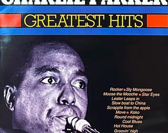 May include: A black and white photo of Charlie Parker, a famous jazz saxophonist, playing his saxophone. The album cover features the text "Charlie Parker Greatest Hits" and lists the songs included on the album.