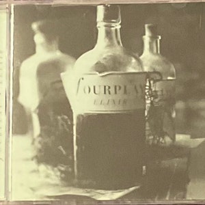 May include: A vintage CD case with a black and white photo of two glass bottles. The larger bottle is labeled "Fourplay Elixir".