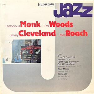 May include: A vintage vinyl record album cover featuring a photo of a city street with a neon sign that reads "Show World Center". The album cover is titled "Europa Jazz" and features the names of the musicians: Thelonious Monk, Phil Woods, Jimmy Cleveland, and Max Roach. The album cover lists the songs: "OW!", "There'll Never Be", "Another You", "Penthouse Serenade", "Out Of Nowhere", "Blue Monk", "Kardouba".