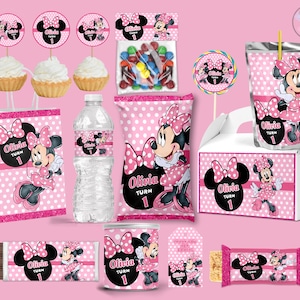 May include: A selection of pink Minnie Mouse party decorations, including cupcake toppers, a candy bag, a water bottle, a juice pouch, a gift box, and a chocolate bar. The designs feature Minnie Mouse and the name "Olivia" with the number "1".