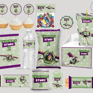 May include: A selection of party decorations and treats with a Buzz Lightyear theme. Includes cupcakes, sweets, a juice carton, a water bottle, a gift bag, a chocolate bar, and other items, all with the text "Thomas Story 2".