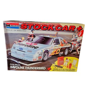May include: A Monogram Stock Car+ model kit of the #28 Havoline Thunderbird race car. The box features the car in action with the text "Davey Allison's Havoline Thunderbird". Includes extra parts and a driver figure.