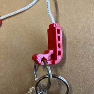 Keychain, life jacket, keychain made from an authentic life vest inflation pull. image 5