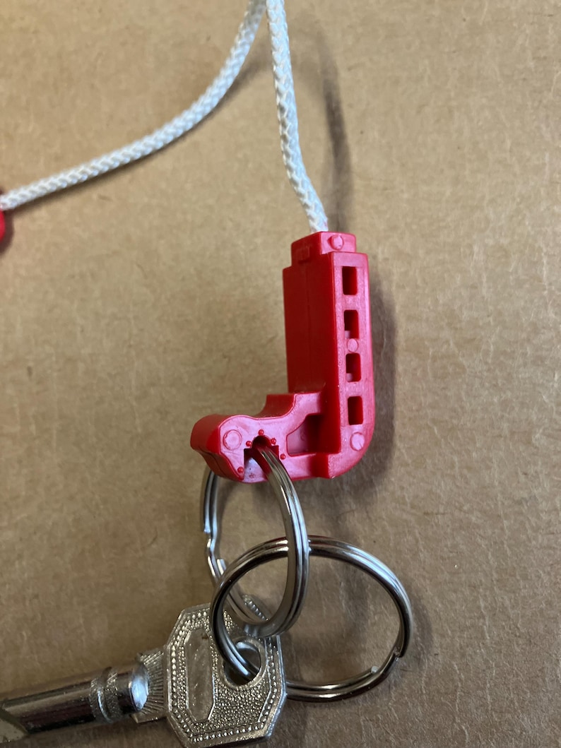 Keychain, life jacket, keychain made from an authentic life vest inflation pull. image 5