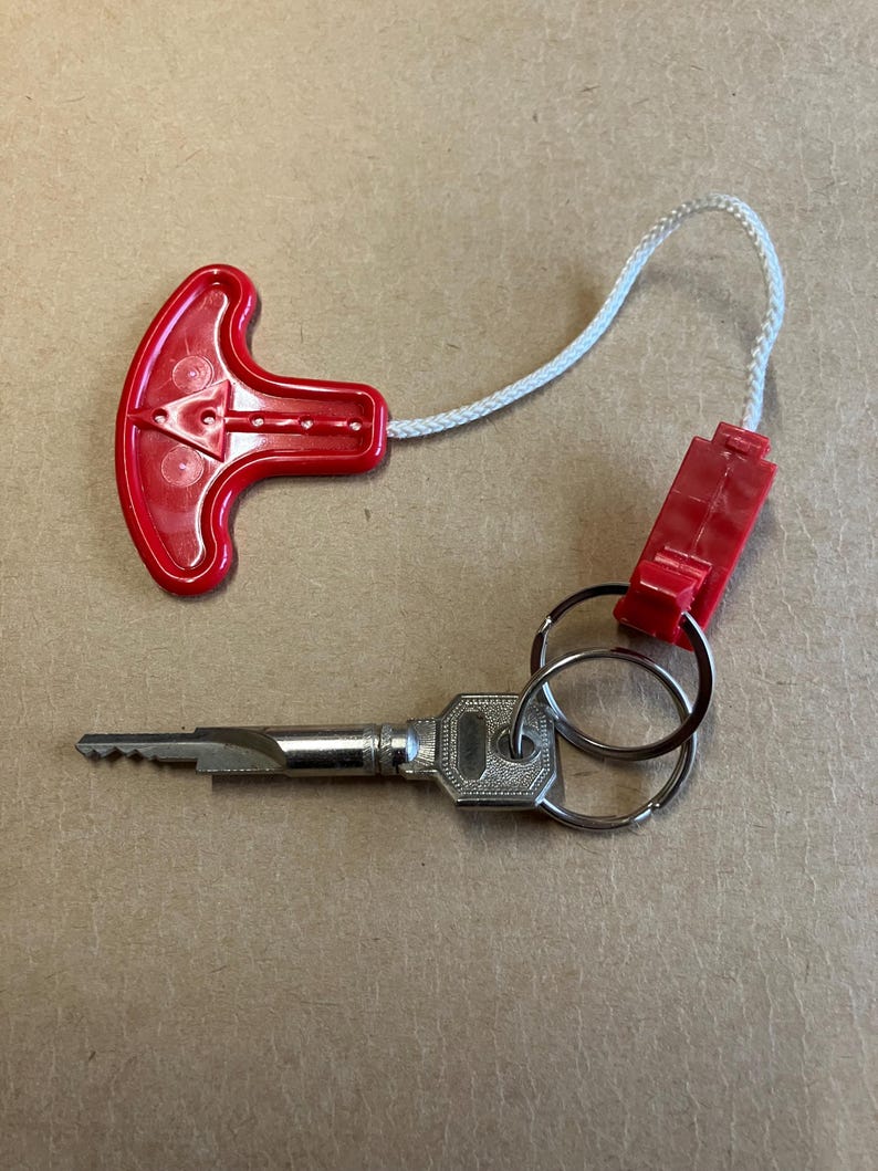 Keychain, life jacket, keychain made from an authentic life vest inflation pull. image 1