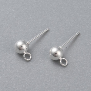 May include: Two silver earring posts with a small round ball at the top and a loop at the bottom.