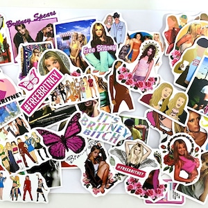 May include: A collection of colourful stickers featuring images of Britney Spears, butterflies, and the text "Free Britney". The stickers are on a white background.
