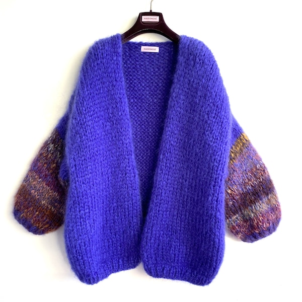 Long oversized ladies cardigan in mauve blue mohair with multicolor stripes on the sleeves.