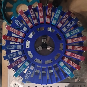 Key chain bottle opener jig rotary attachment