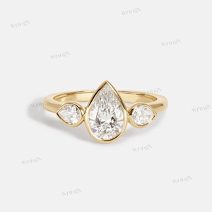 Gold Pear-Cut Moissanite Ring – Unique Three-Stone Engagement Band