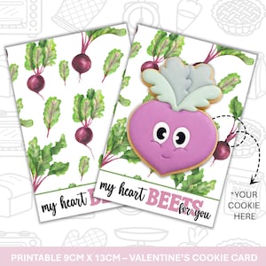 May include: Valentine's Day cookie card with a beet-shaped cookie design. The card features a watercolor illustration of beets and the phrase "my heart beets for you." The card measures 9cm x 13cm.